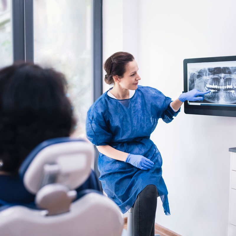 Dentist explaning patient about his Dental Procedure at OKC Dentistry in Oklahoma City. 