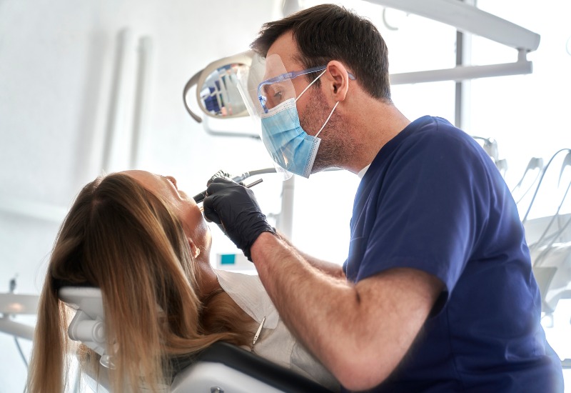 Patient receiving emergency dental treatment from a skilled dentist at OKC Dentistry in Oklahoma