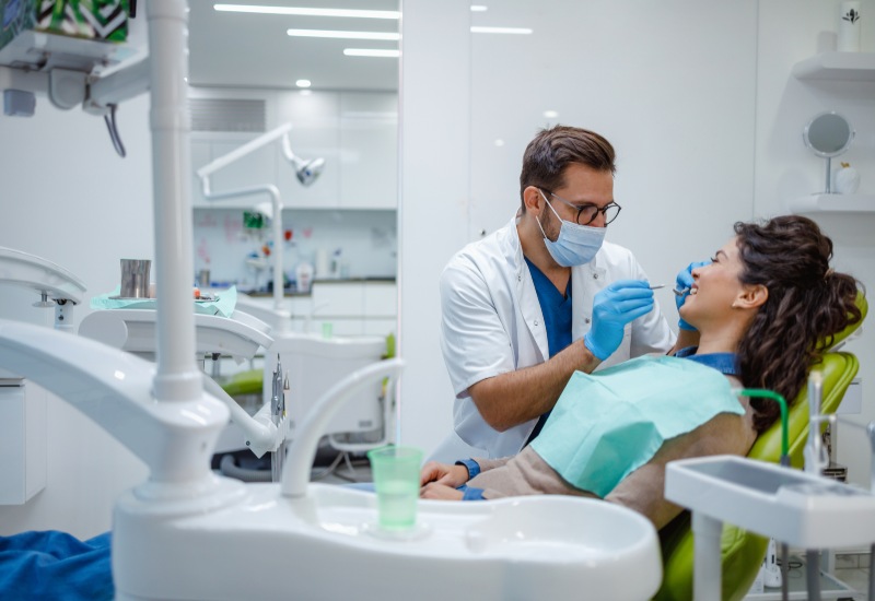 Dentist performing a dental cleaning during a general dentistry appointment at OKC Dentistry.